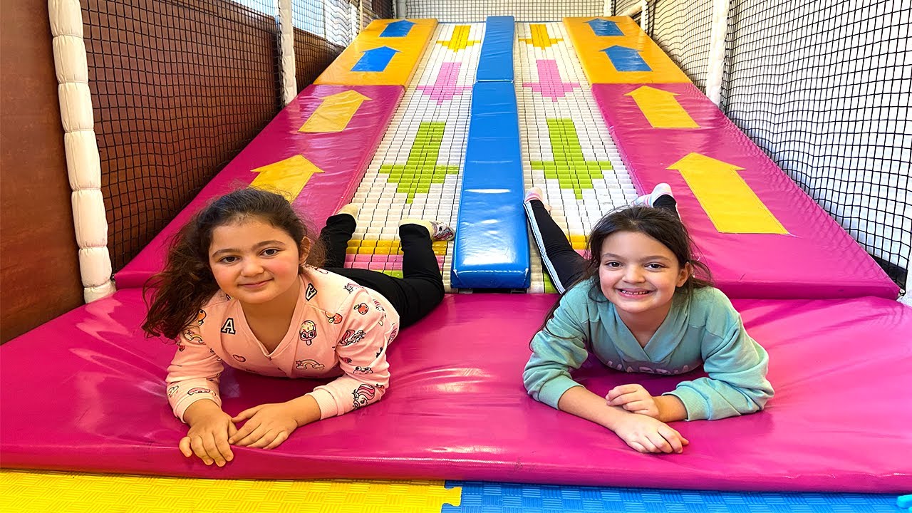Masal and Öykü  have fun playing at the Indoor Playground for kids