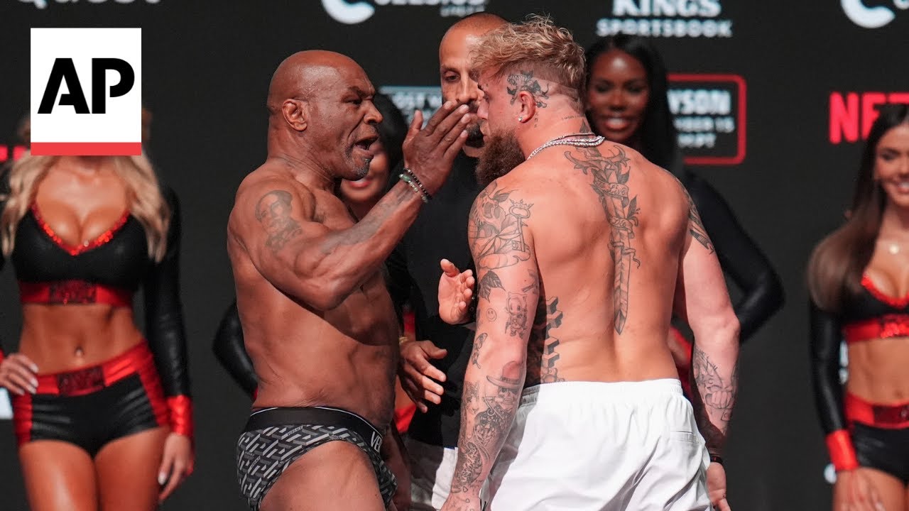 Mike Tyson slaps Jake Paul during their weigh-in before fight