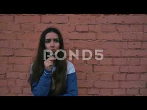 Mod sport healthy young girl in front of the wall  Urban teenager Caucasian ethnicity female student