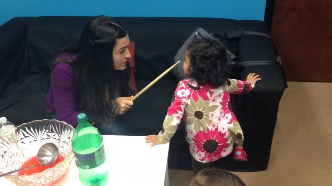 Mom Spanking her kid with a drum stick