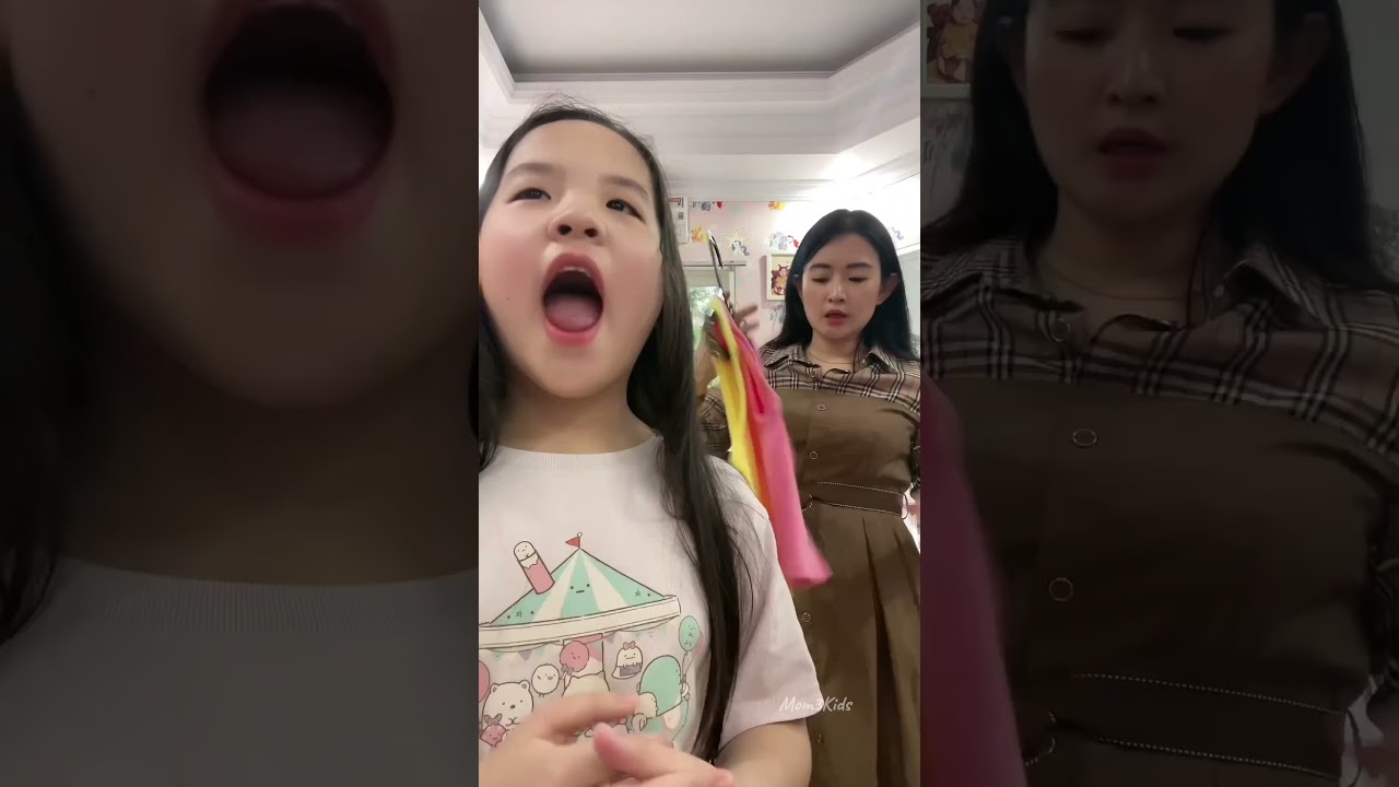 Mommy is annoyed that she doesn't like wearing all the clothes