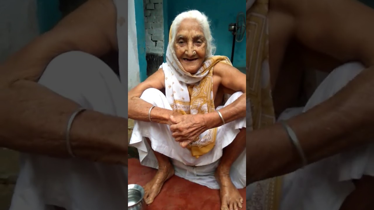 My sweet grandmother is laughing while she was bathing in the morning at village on 7th june 2017