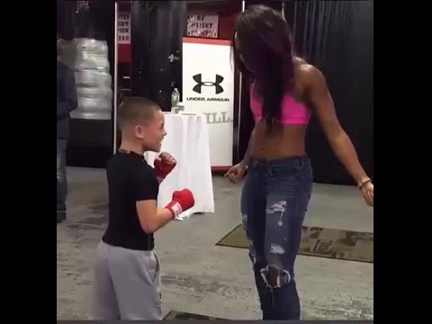 Natasha Hastings's abs punch challenge to young boxer