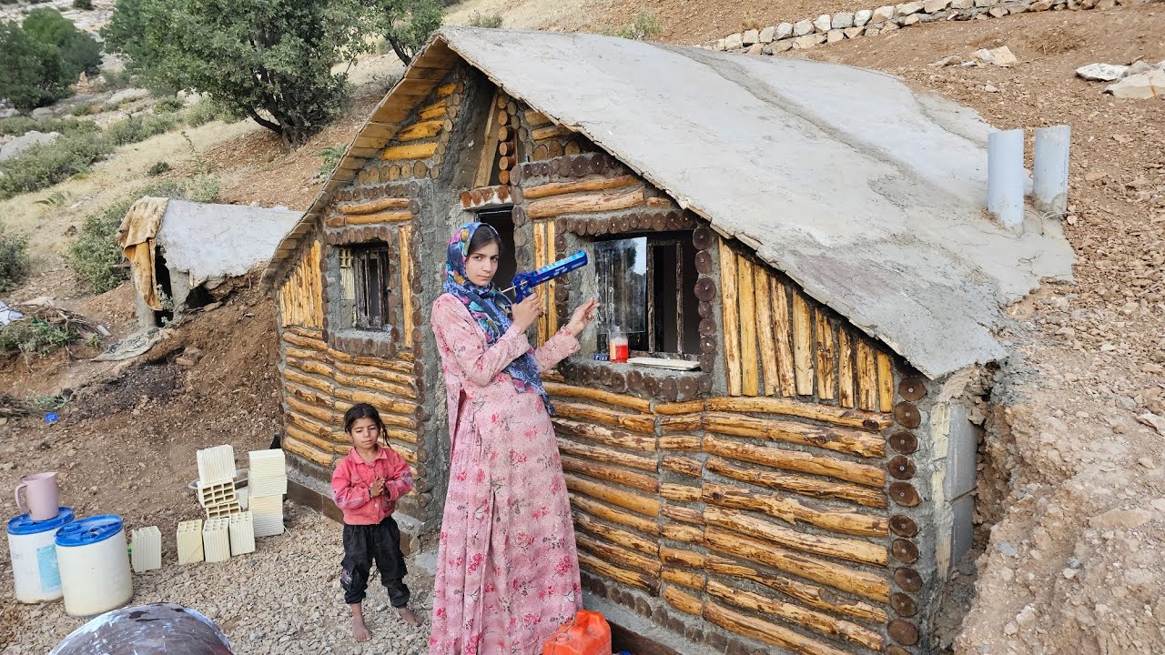 Nomadic mother installs glass in windows; shelter becomes brighter and warmer 🪟🛖