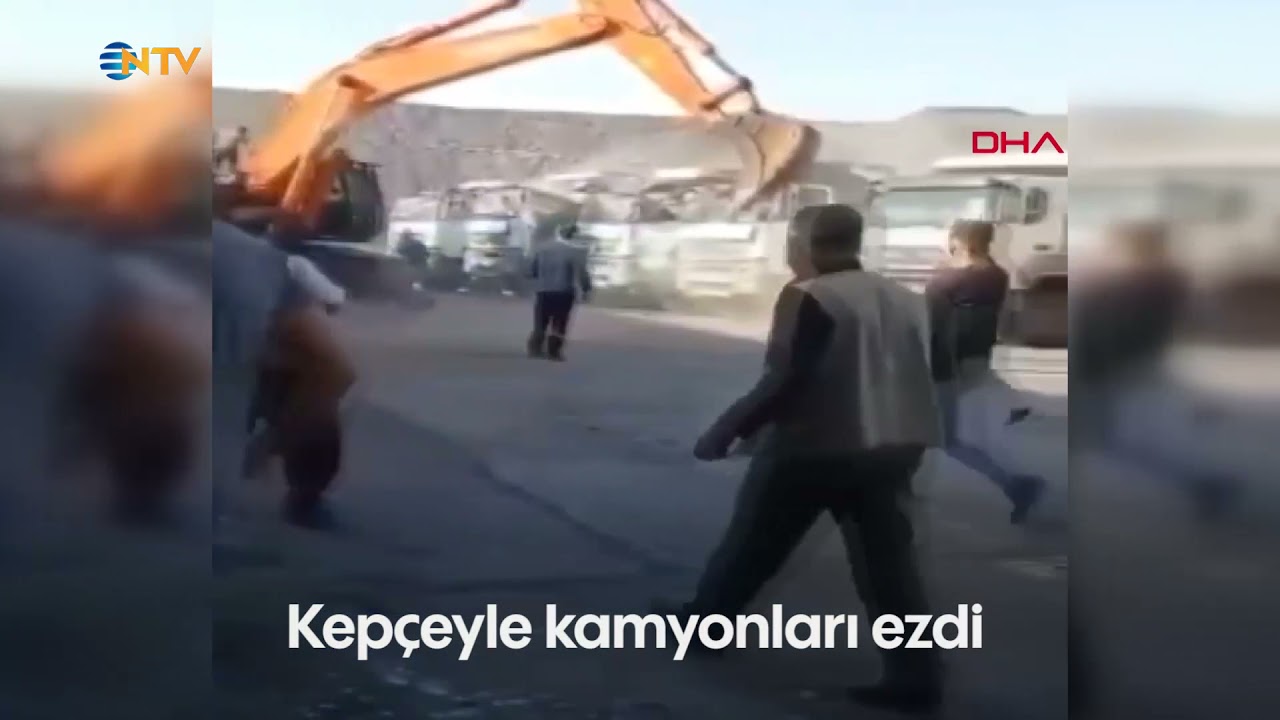NTV | Ücretini alamayan işçi kepçeyle kamyonları ezdi