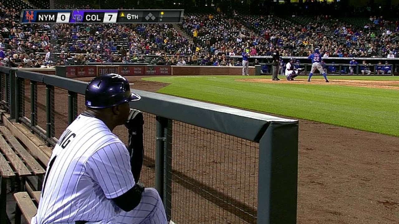 NYM@COL: Eric Young, Jr. bats while dad looks on