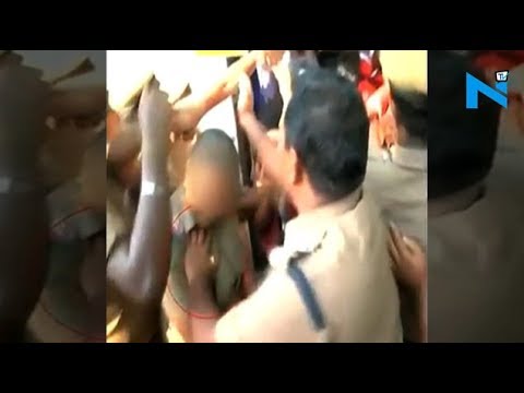 On Cam:  Senior police officer caught groping woman cop during NEET protests
