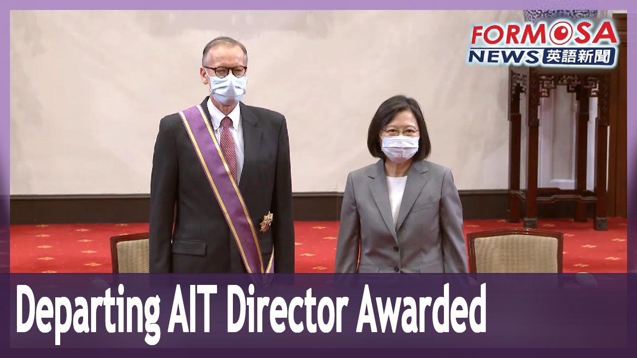 Outgoing AIT Director Brent Christensen receives award from president