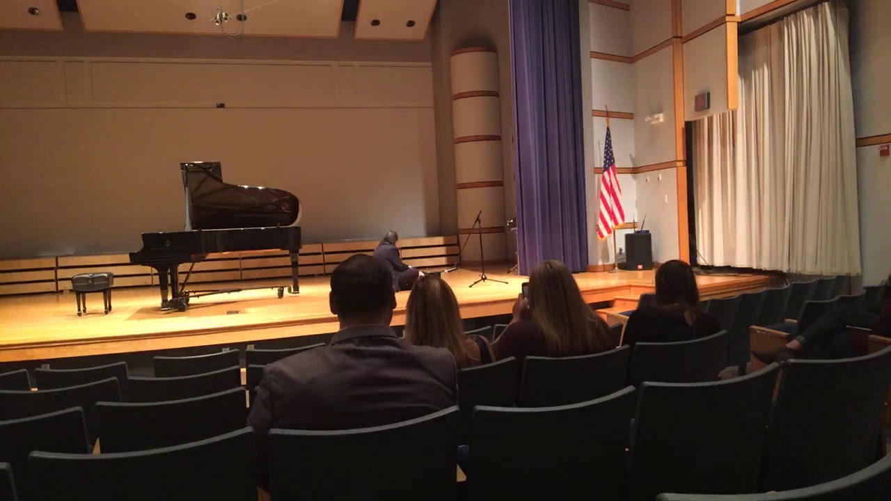 Piano Professor plays miniature piano like Schroeder from “Peanuts.”