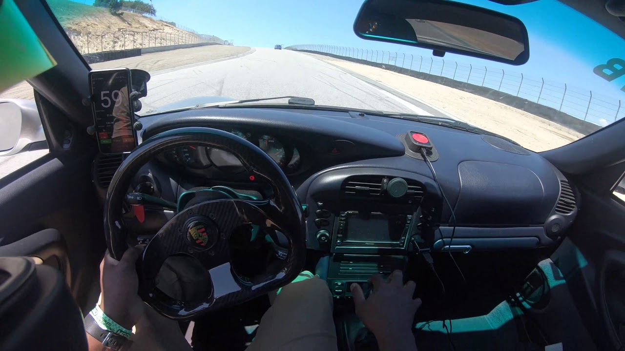 Porsche 996 911 having fun @ Laguna Seca - Classic 911 snap oversteer on turn 9