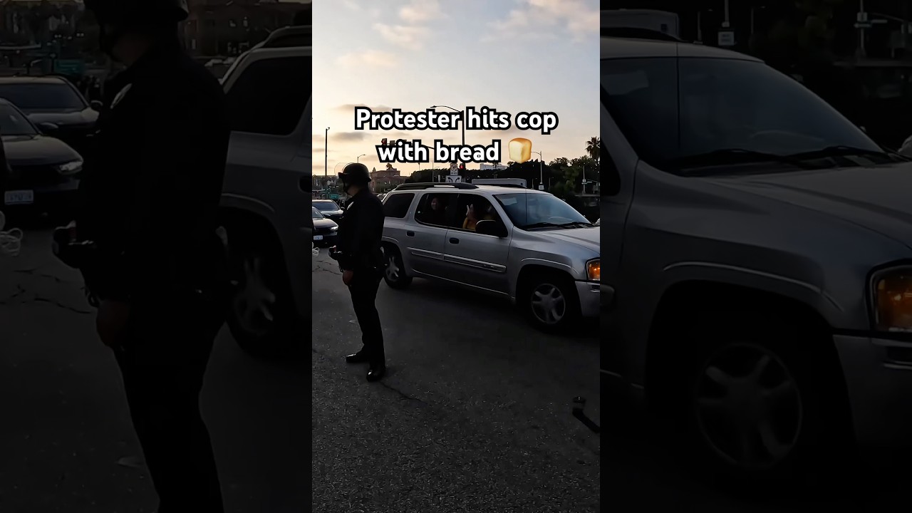 Protestor throws bread at cop #losangeles #raw #shorts #viral