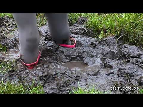 qmd2 Pink rubber boots sink in deep mud