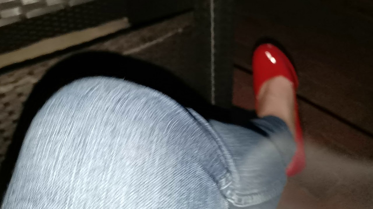 Red Tamaris heels and skinny  blue jeans