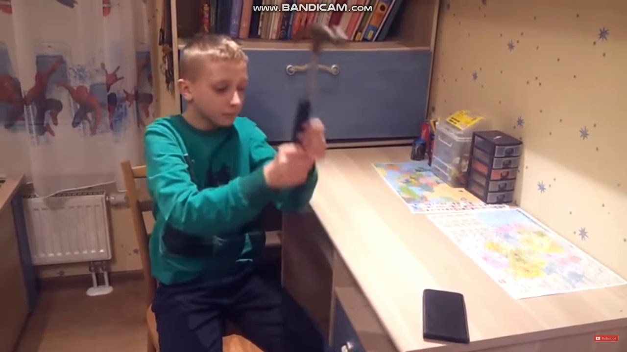Russian kid hits his phone for one minute with a hammer, but his phone isnt broken