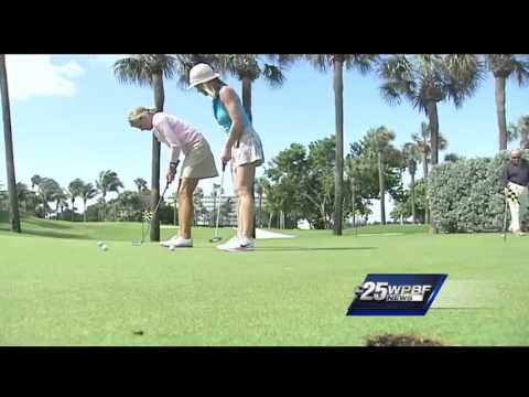 Sandra Shaw takes a golf lesson