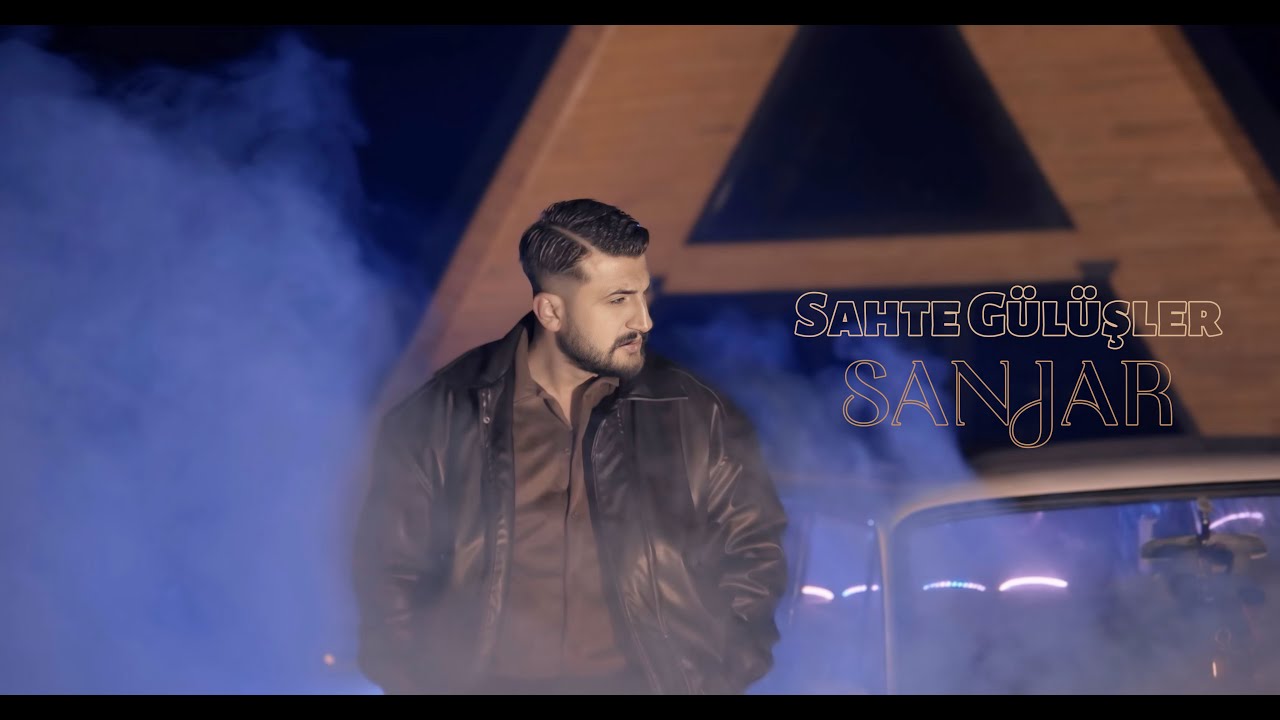 Sanjar - Sahte Gülüşler ( Official Video )