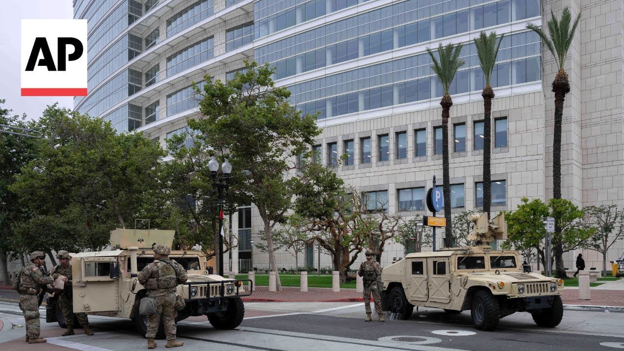 Santa Ana locals give arriving National Guard troops food and water