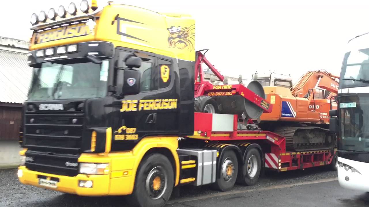 Scania 164 580 with Hitachi EX 120 and FH 130 on a low loader
