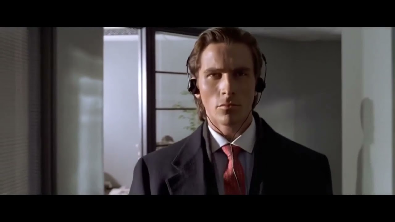 serious man walking with headphones