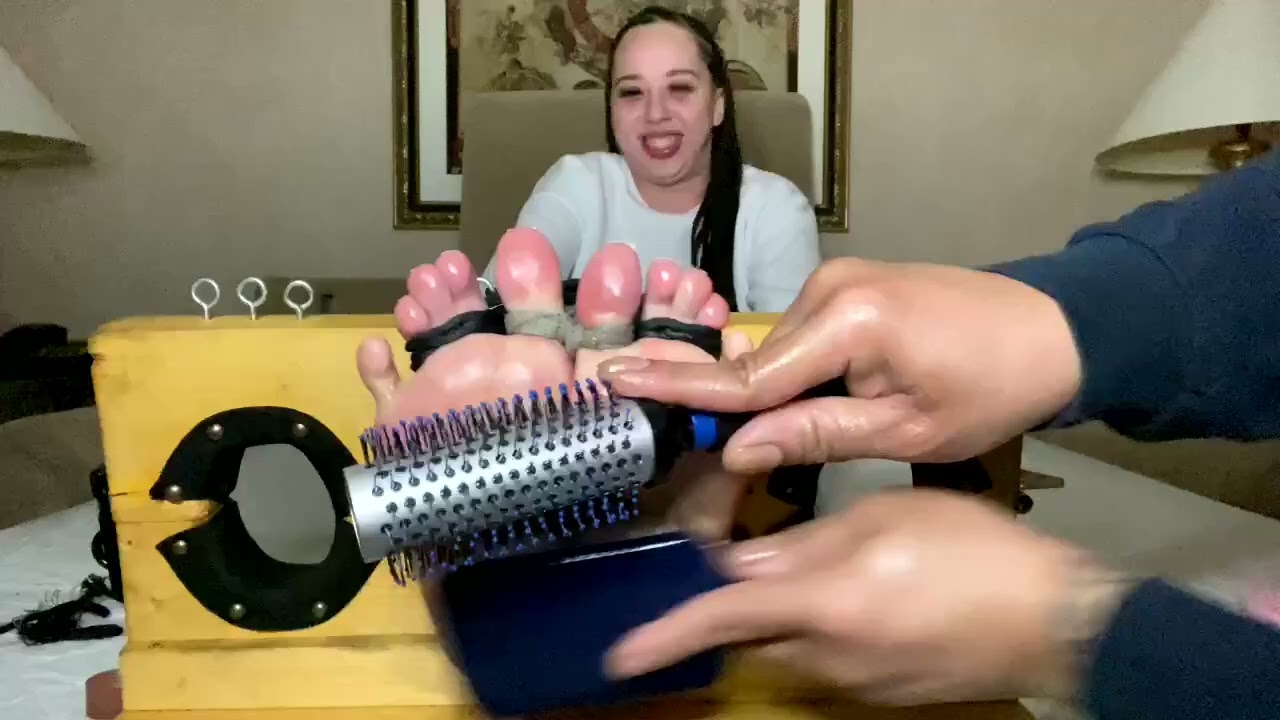 She could not resist this tickling session on her feet.