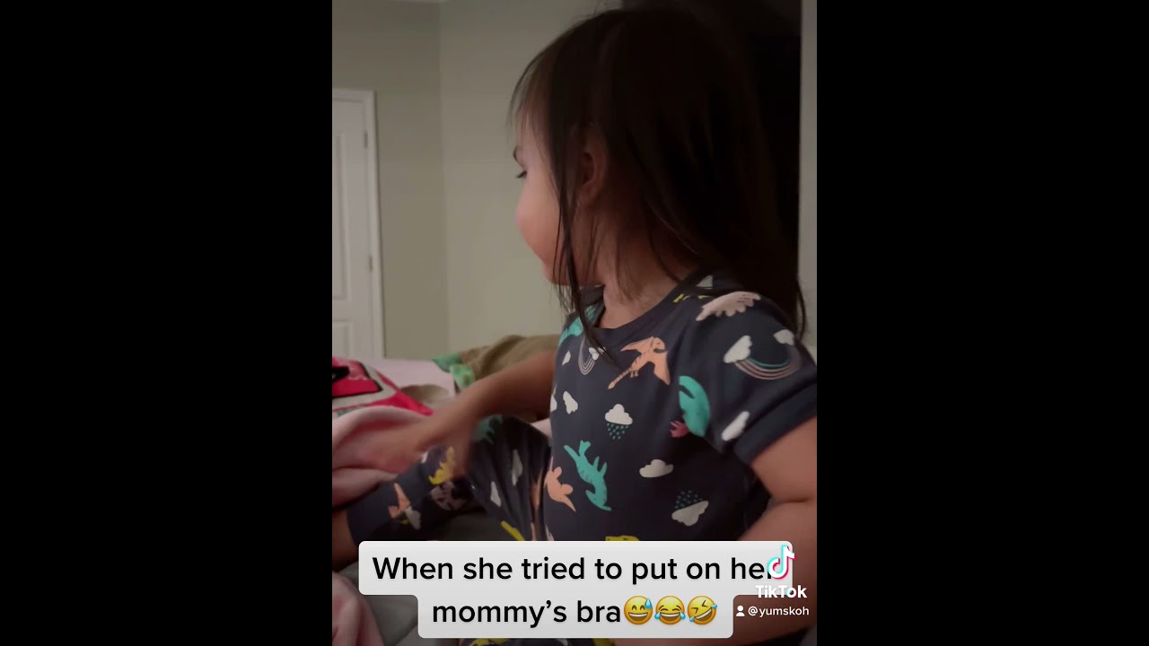 She tried to put on her mom’s bra😅😂🤣 #shorts #toddler #terribletwo