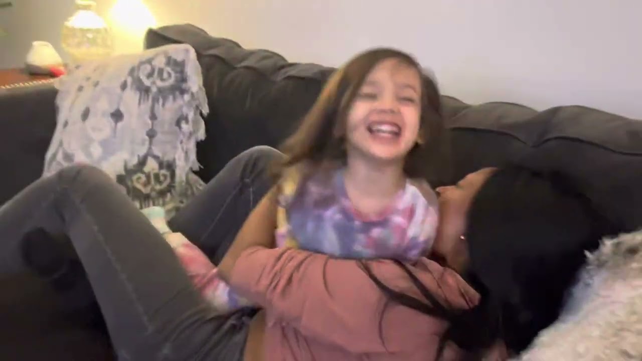 Sienna blowing on mommy’s belly
