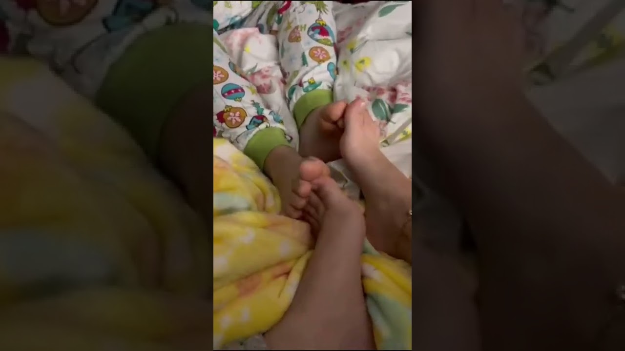 Sisters playing footsies 6