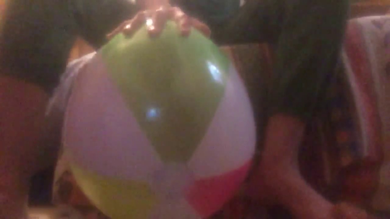 Sitting on a crappy beachball until it pops
