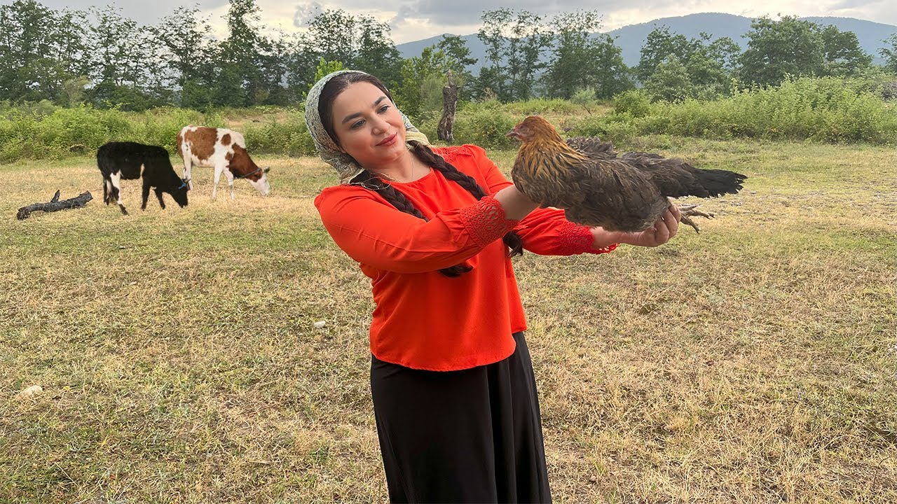 Slaughtering chicken by village girl | woman's skill in slaughtering chicken and cooking over fire