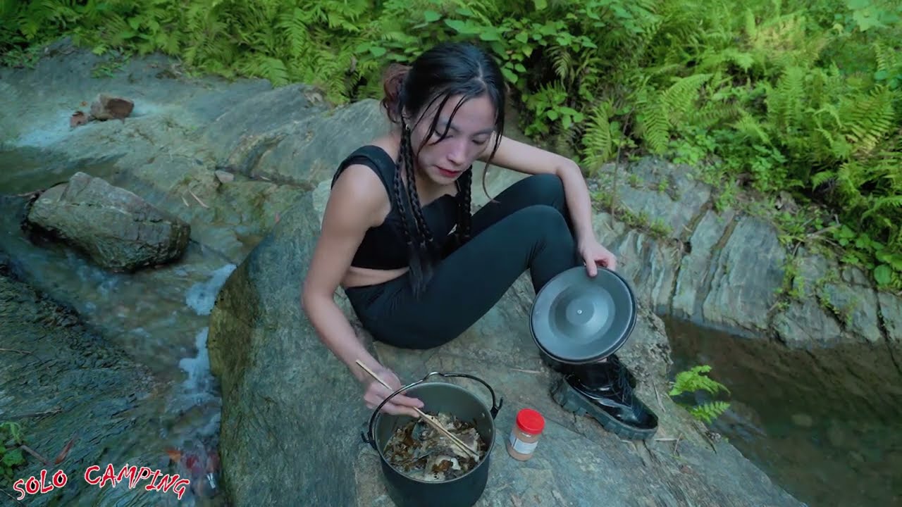 Solo Camping deep in the forest, relaxing with stunning mountain scenery on a sunny day