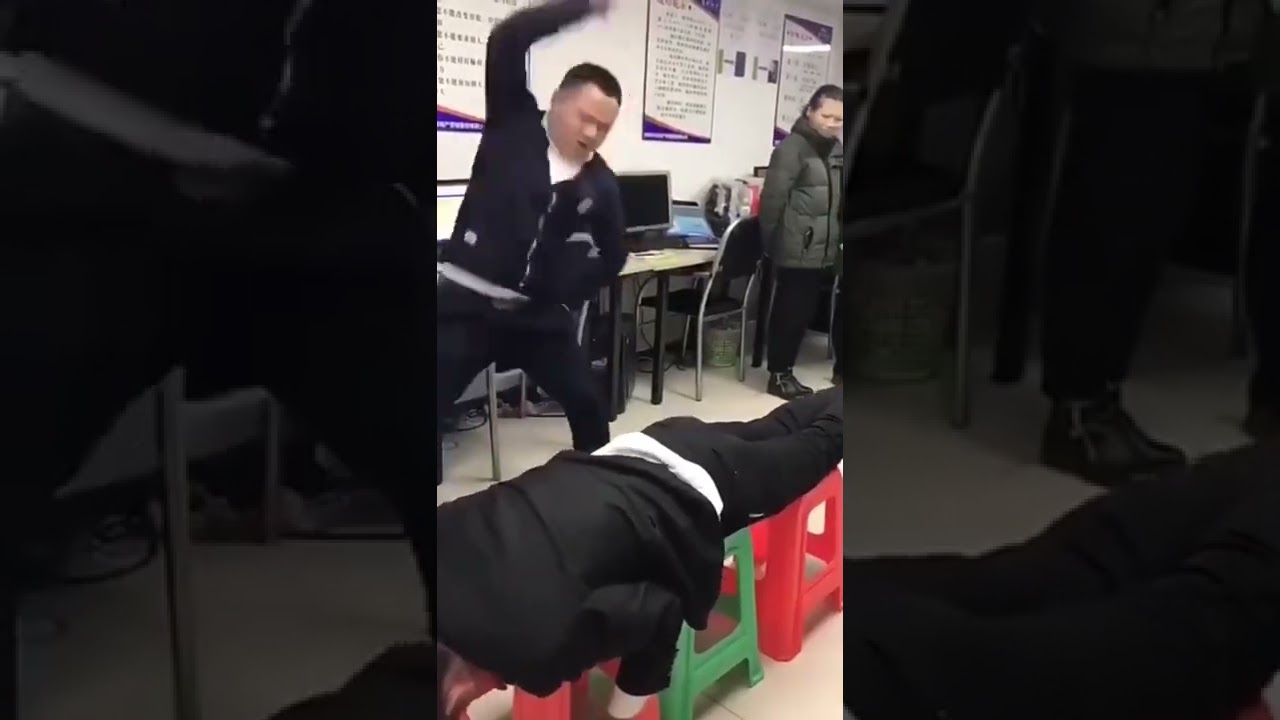 Somewhere in China, boss spanks worker