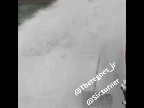 Son Blows Snow On Dad