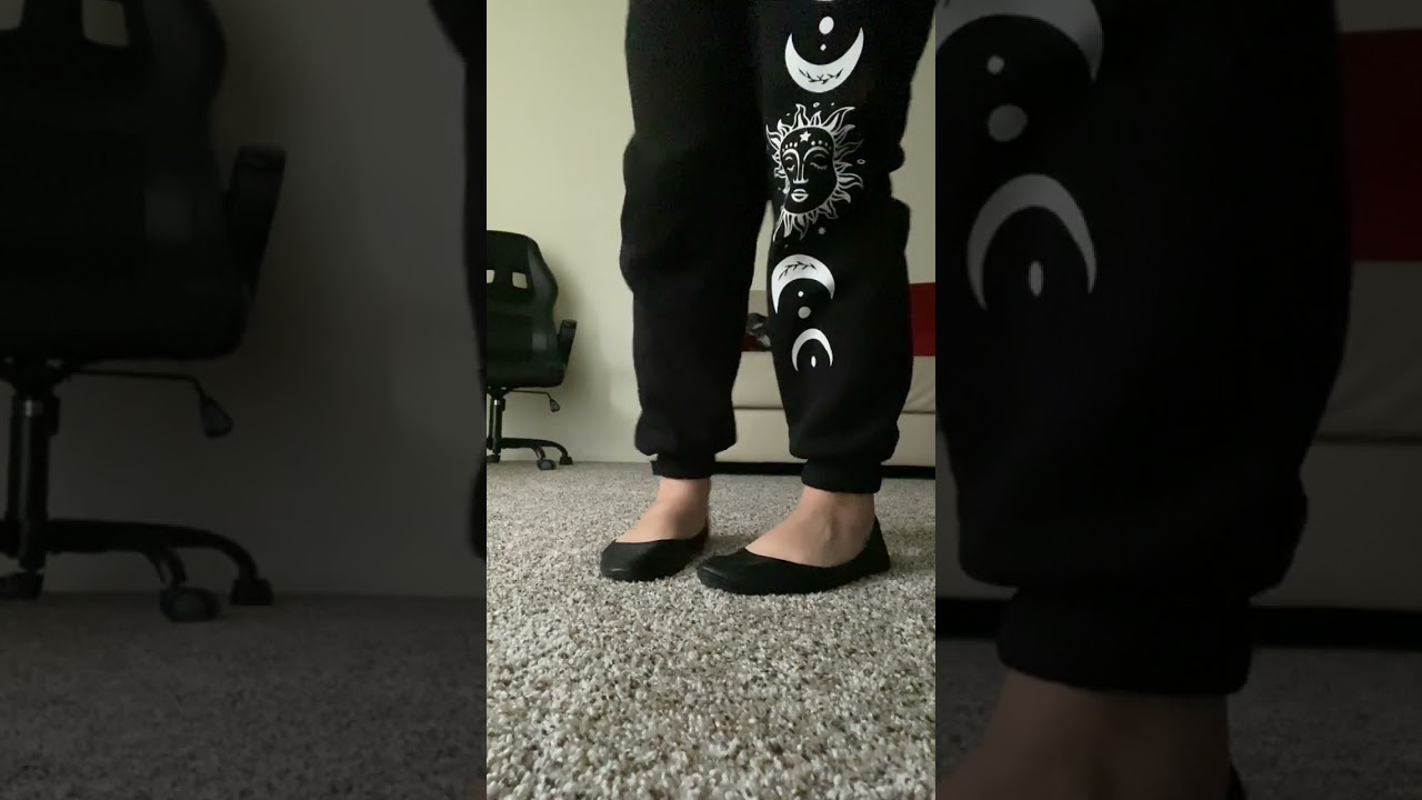 Standing shoeplay in black flats