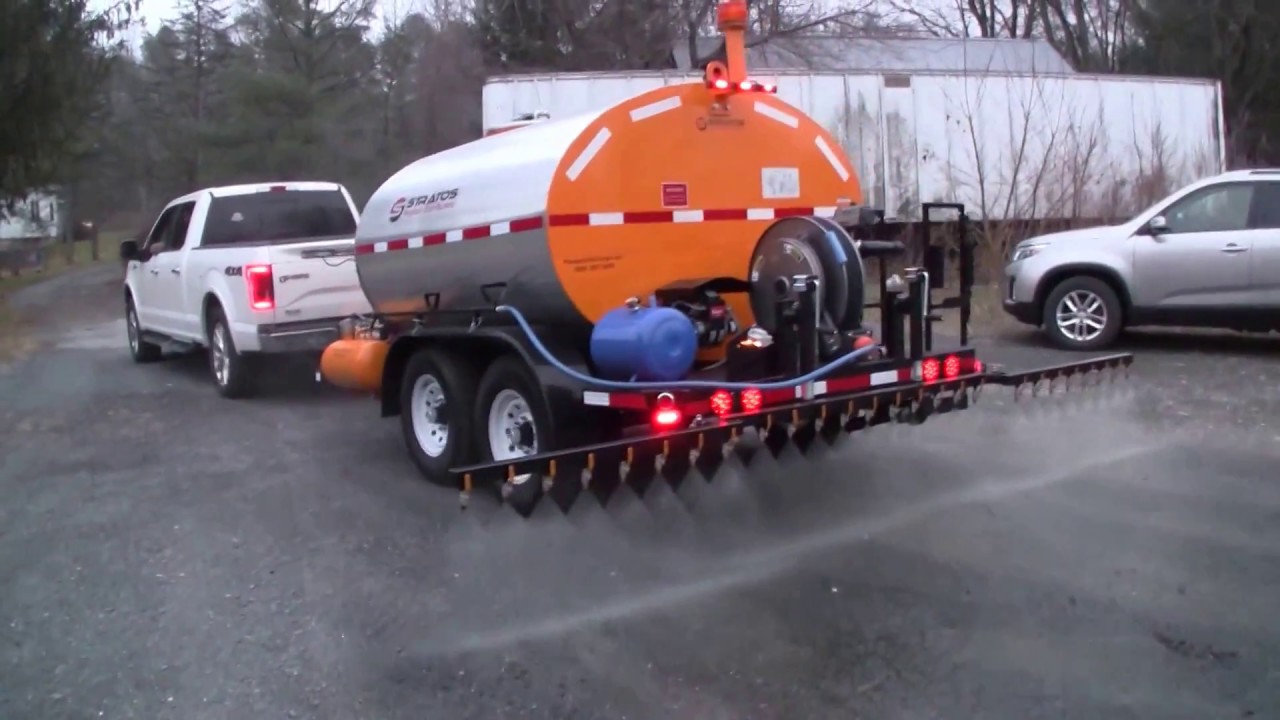 STRATOS DMT1000 Gallon Asphalt Distributor Trailer, Spraying 14' spraybar with our 60gpm Viking pump