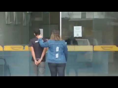 The suspect was handcuffed and arrested by a female police officer.