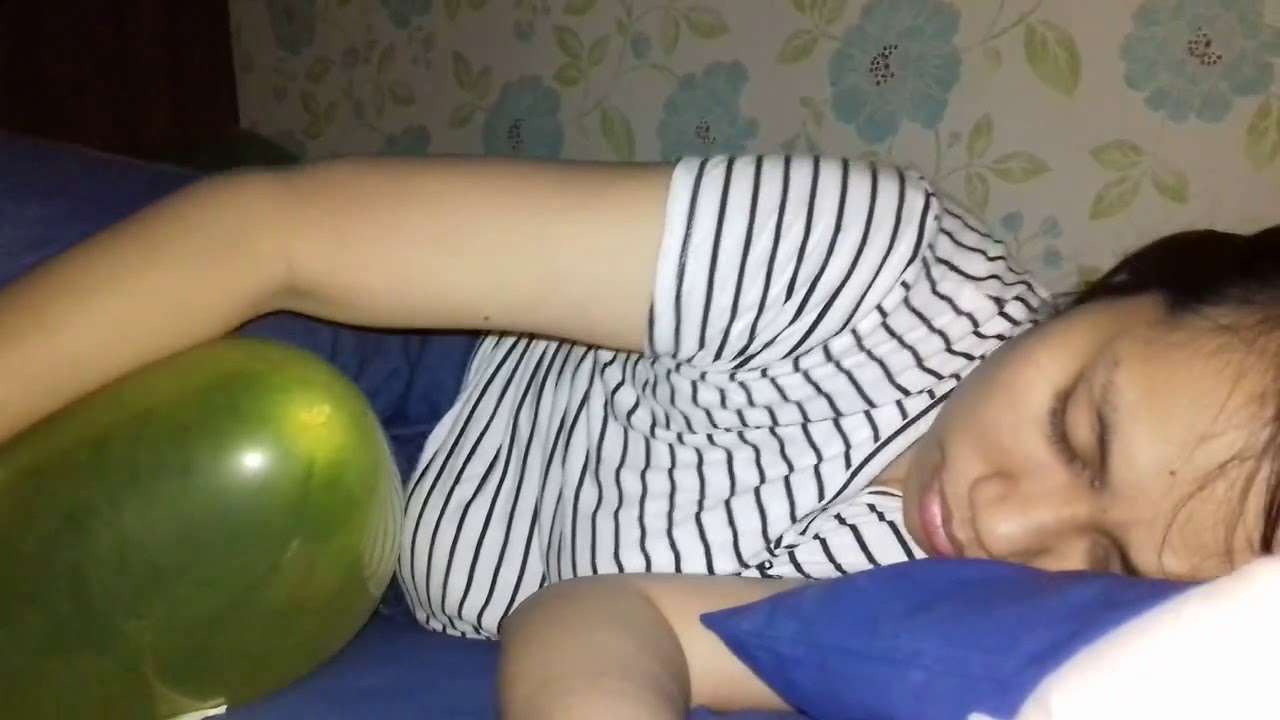 Tired Girl Nail Pops a Balloon