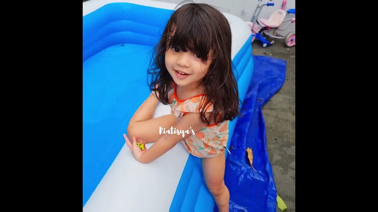tisya with orange swimsuit