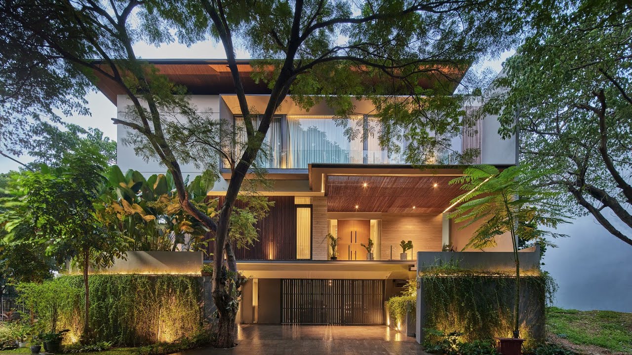 Tropical House on the Corner with Lush Green Surroundings by RAKTA STUDIO