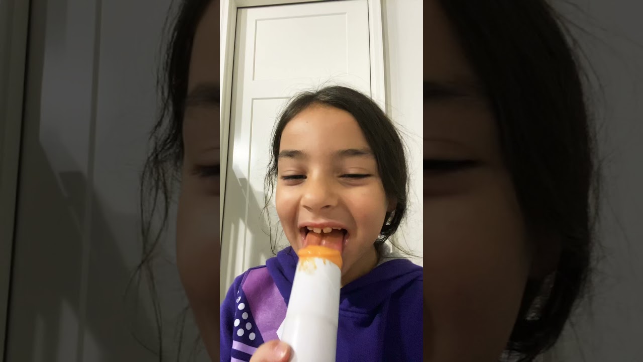 Trying a orange push pop ice cream 🍨