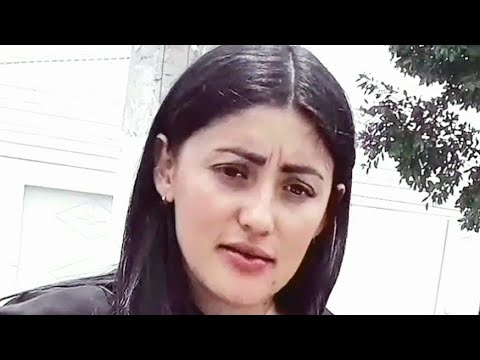 TWO BEAUTIFUL WOMEN LOOK CURIOUSLY AT CLIENT WHILE TALKING
