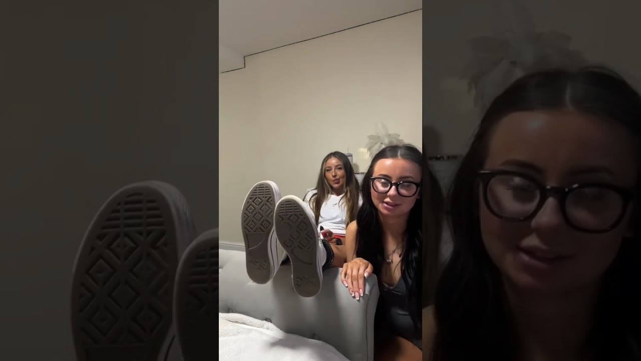 Two girls tickle each other