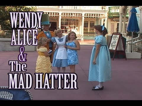 WDW Alice, the Mad Hatter, and Wendy from Peter Pan with Park Guests at the Magic Kingdom