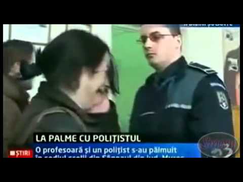 Woman slaps a police officer and gets happy slapped back, then starts crying..